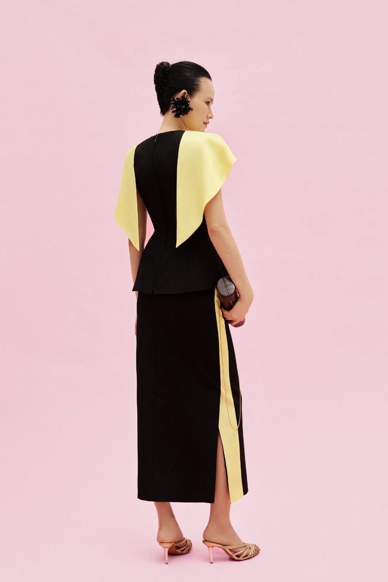 Jenny K Tran Clevedon midi skirt in flowing fabric, featuring a stylish design and elegant length, perfect for versatile outfits.
