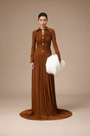 Jenny K Tran Clichy Dress in Ginger, a stylish gown with a flowing silhouette and warm ginger color, shown on a model.