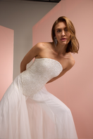 Close-up of Joanna Andraos white corset top with matching palazzo trousers, showcasing the elegant co-ord set.
