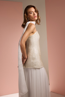 Closeup of white Joanna Andraos strapless co-ords set with matching skirt and scarf, showcasing fabric details and stylish design.