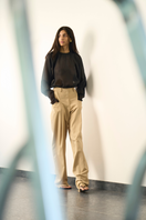 Black ERIN top by URA, stylish sleeveless blouse with a fitted design, displayed on a neutral background.
