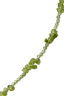 Aethera Soraia Peridot Necklace in vibrant green with a delicate pendant on a fine chain.