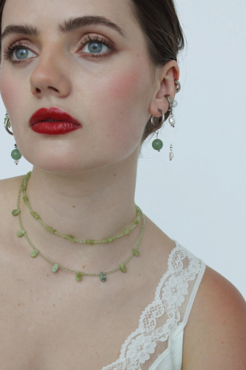 Aethera SORAIA peridot necklace in vibrant green with delicate chain and pendant, showcasing elegant jewelry design.