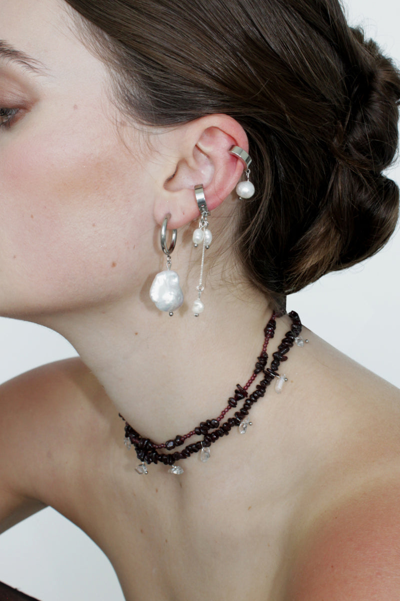 Aethera MUNAI Garnet and Clear Quartz Necklace with vibrant red garnet stones and clear quartz beads on a delicate chain.