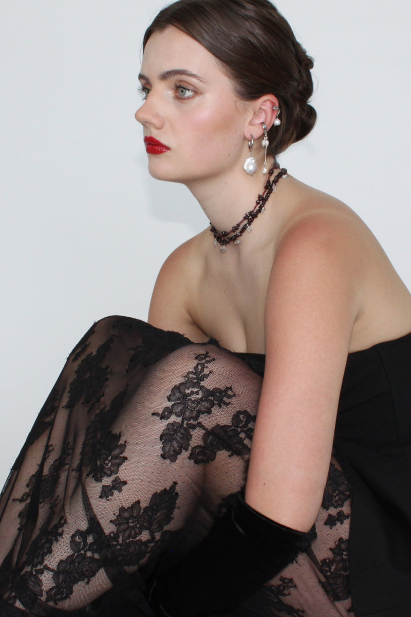 Aethera MUNAI Garnet and Clear Quartz necklace featuring red garnet stones and clear quartz beads on a delicate chain.