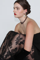 Aethera MUNAI garnet and clear quartz necklace featuring a red gemstone pendant on a delicate chain.