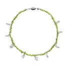 Aethera Toru Peridot necklace featuring a vibrant green gemstone pendant on a delicate chain.