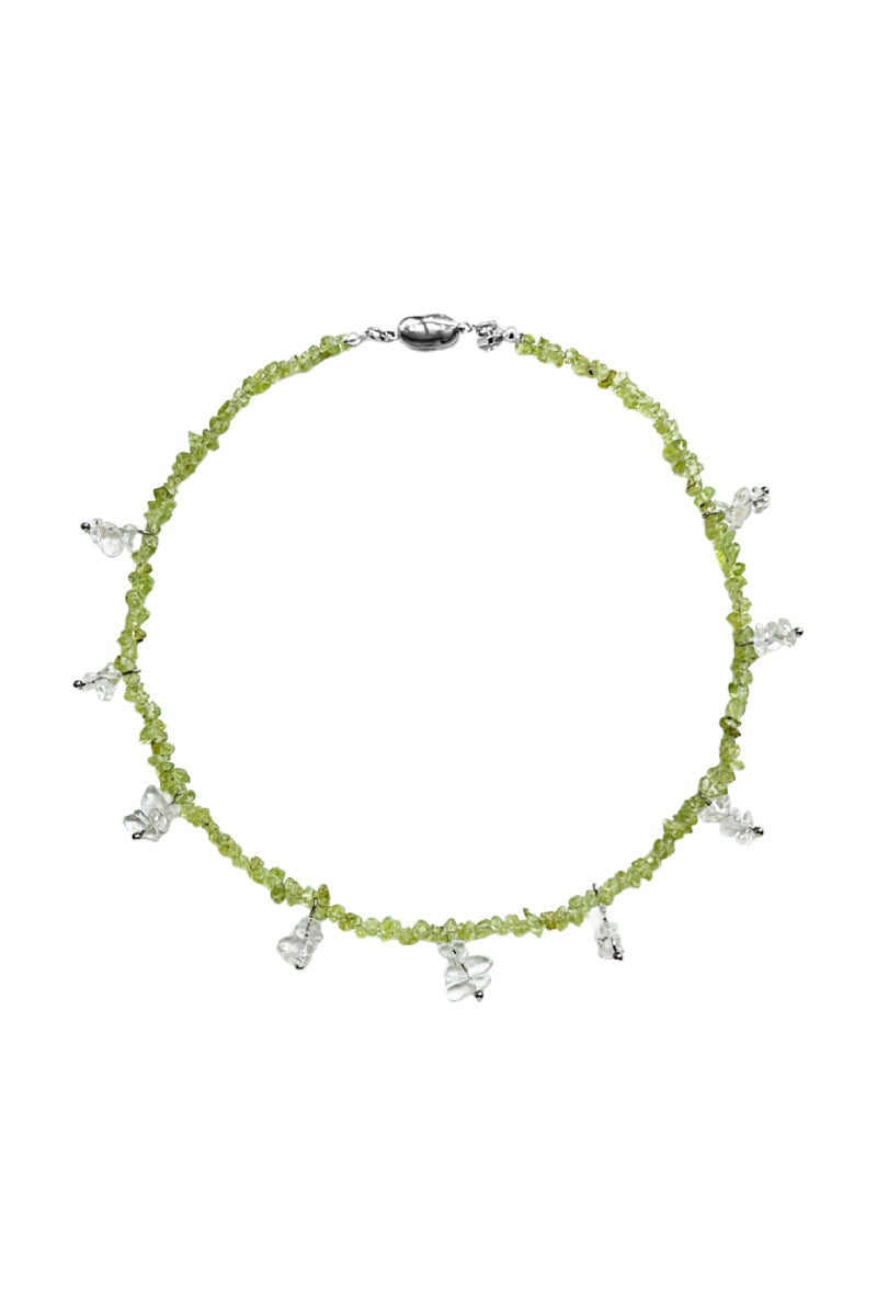 Aethera TORU Peridot Necklace featuring a vibrant green gemstone on a delicate chain.