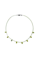 Aethera Catana Peridot and Serpentine necklace featuring green gemstones on a delicate chain.