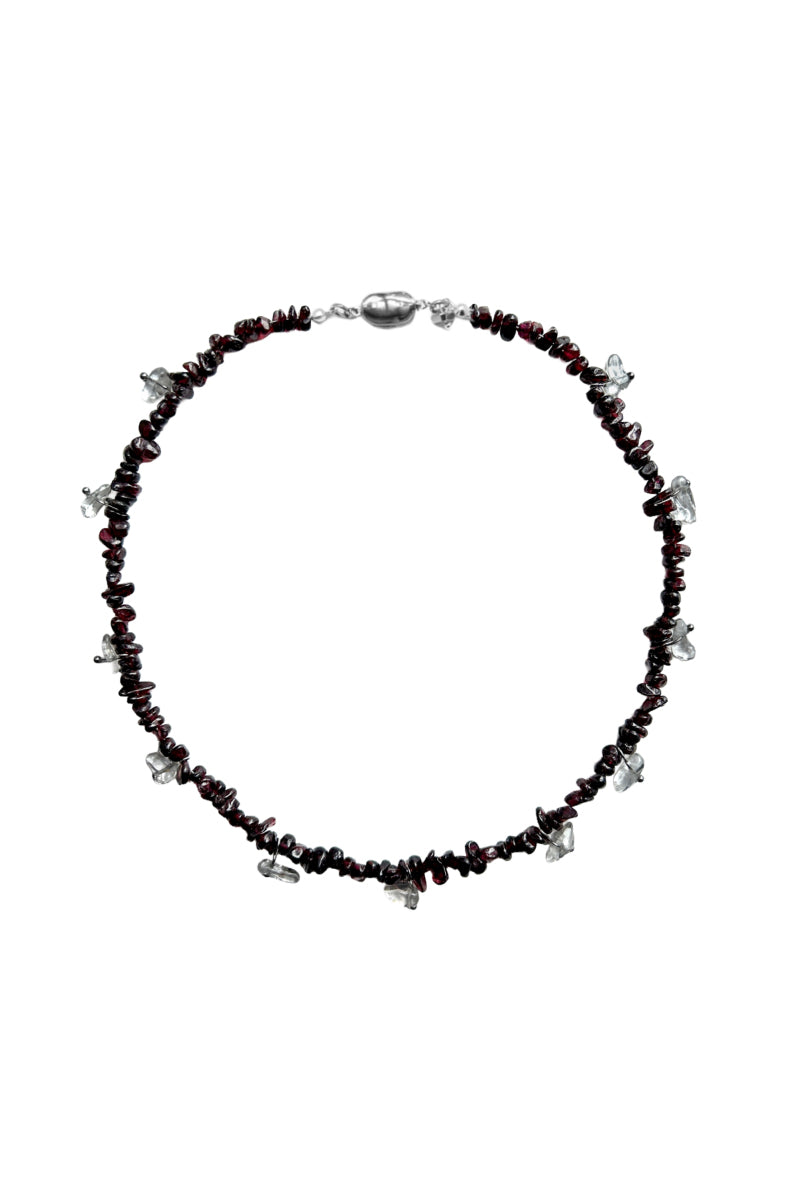 Aethera MUNAI garnet clear quartz necklace featuring a red gemstone pendant on a delicate chain.