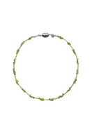 Aethera SORAIA Peridot Necklace in vibrant green with delicate chain and gemstone pendant, showcasing elegant jewelry craftsmanship.