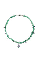 Aethera Blaine aventurine charm necklace featuring green gemstone beads and a silver charm pendant on a delicate chain.