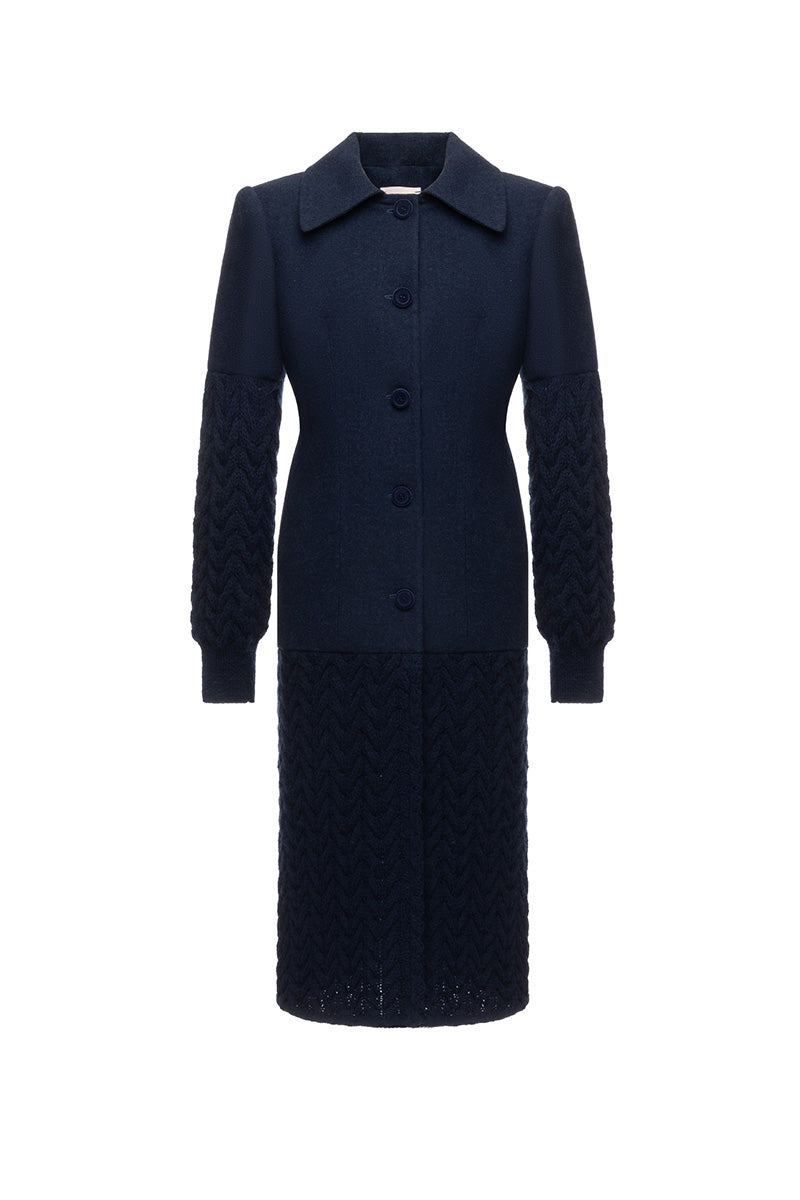 Long navy statement coat by Liya featuring a sleek, tailored design with a modern silhouette and full-length style.