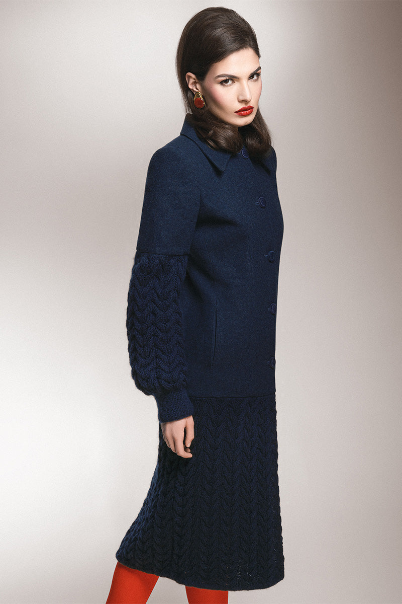 Long navy statement coat by Liya featuring a sleek design with a tailored fit and stylish lapel collar.