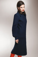 Long navy statement coat by Liya featuring a sleek design with a tailored fit and stylish lapel collar.