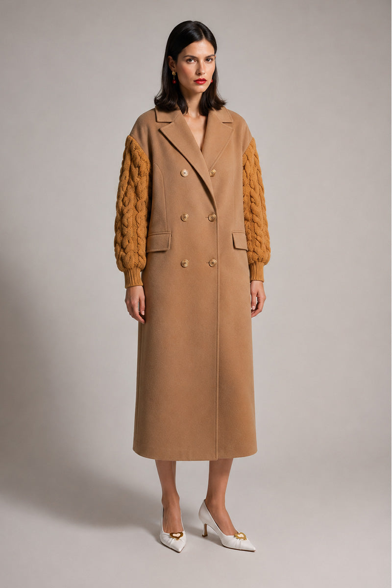 Liya dramatic camel knit-sleeve coat displayed on a hanger, featuring a cozy, textured knit fabric and stylish design.