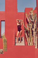 Reversible asymmetrical Coco Terry swimsuit by Talia Collins featuring a stylish, unique design and vibrant swim fabric.