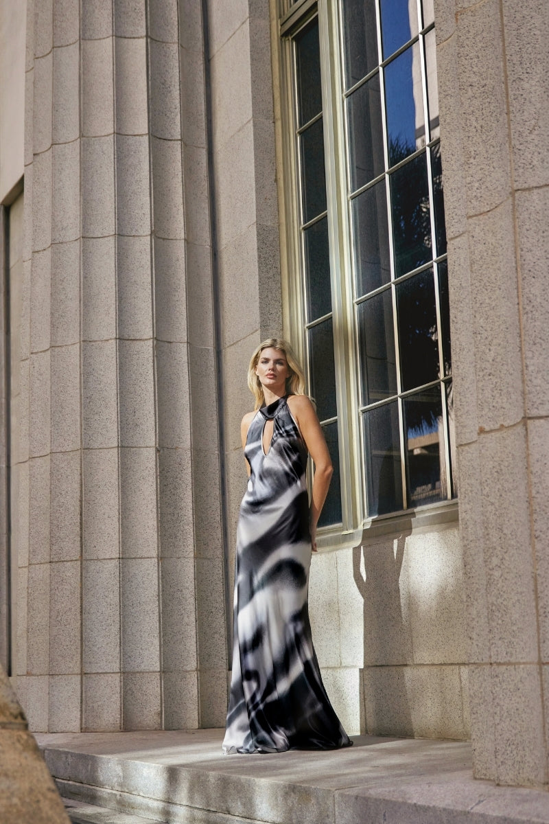 Black printed cocoa dress by Tinta Latina, stylish maxi dress with a flowing silhouette and vibrant print design.
