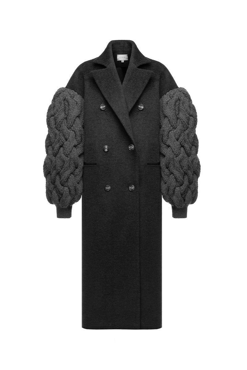 Liya dramatic charcoal knit sleeve coat displayed on a hanger, featuring textured knit fabric and stylish long sleeves.