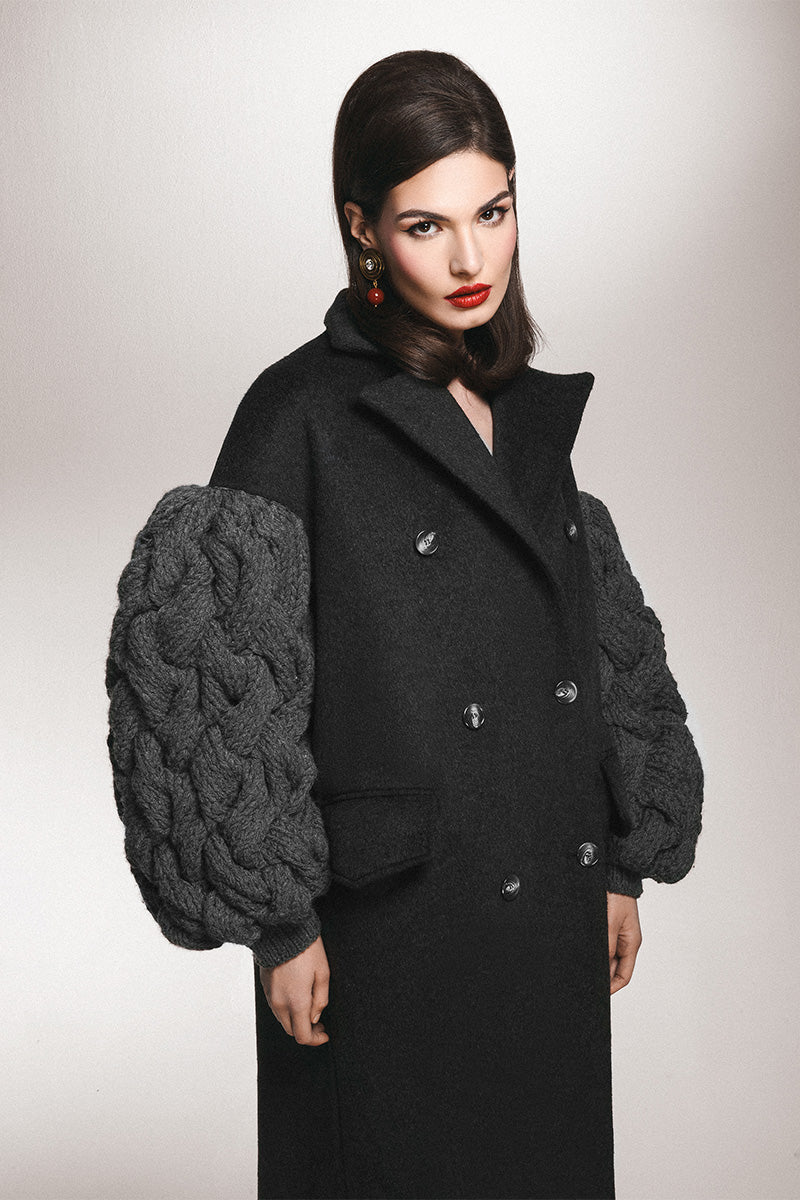 Liya dramatic charcoal knit sleeve coat featuring a stylish design with textured knit sleeves and a tailored fit.
