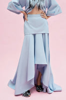 Jenny K Tran Colchester Maxi Skirt in flowy fabric with a high waist and tiered design, showcased in a full-length view.