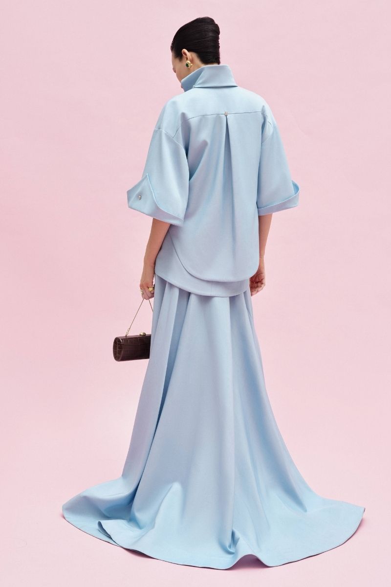 Jenny K Tran Colchester Maxi Skirt in flowing fabric with a comfortable waistband, shown in a stylish, full-length view.