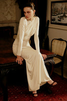 Gigii's COMO Maxi Dress featuring a flowing fabric and elegant design, perfect for casual or formal summer occasions.