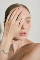 Silver Consciencia bracelet by Eugenia Ospina featuring a sleek, minimalist design with intricate detailing and a secure clasp.