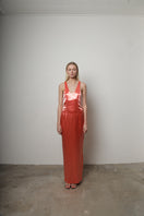 Junie coral maxi dress featuring a flowing design and sleeveless style, perfect for casual or summer wear.