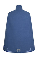 Nadya Shah Olympia denim cape jacket displayed on a hanger, showcasing its stylish design and texture.