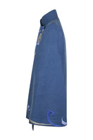 Nadya Shah Olympia denim cape jacket shown front view, featuring classic denim fabric and stylish design details.