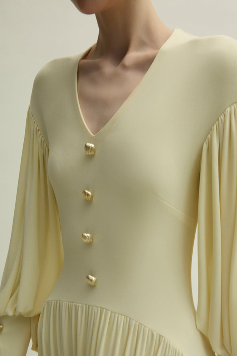 Yellow Cranley dress by Jenny K Tran featuring elegant gown design with flowing fabric and stylish neckline.