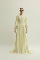 Yellow Cranley dress by Jenny K Tran, elegant gown with flowing fabric and detailed design, shown in a full-length view.
