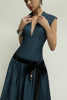 Dark blue Cricklade dress by Jenny K Tran, elegant gown with flowing fabric and detailed design, perfect for formal occasions.