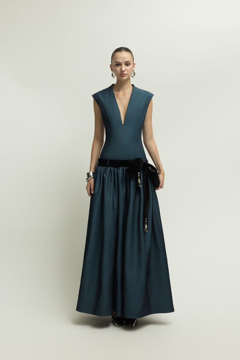 Dark blue Cricklade dress by Jenny K Tran, elegant gown with flowing fabric and stylish design, perfect for formal occasions.