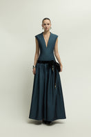 Dark blue Cricklade dress by Jenny K Tran, elegant gown with flowing fabric and stylish design, perfect for formal occasions.