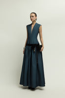 Dark blue Cricklade gown by Jenny K Tran, elegant evening dress with flowing fabric and sophisticated design.