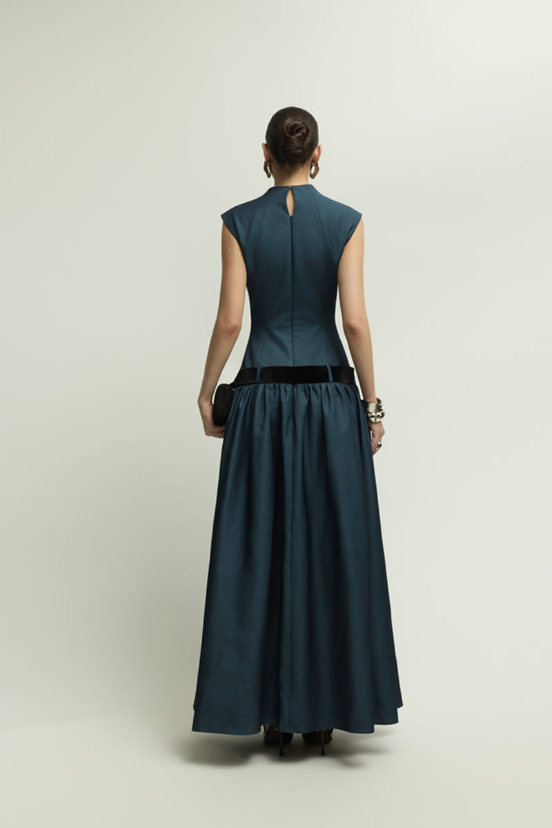 Dark blue Cricklade dress by Jenny K Tran, elegant gown featuring flowing fabric and a sophisticated silhouette.