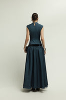 Dark blue Cricklade dress by Jenny K Tran, elegant gown featuring flowing fabric and a sophisticated silhouette.