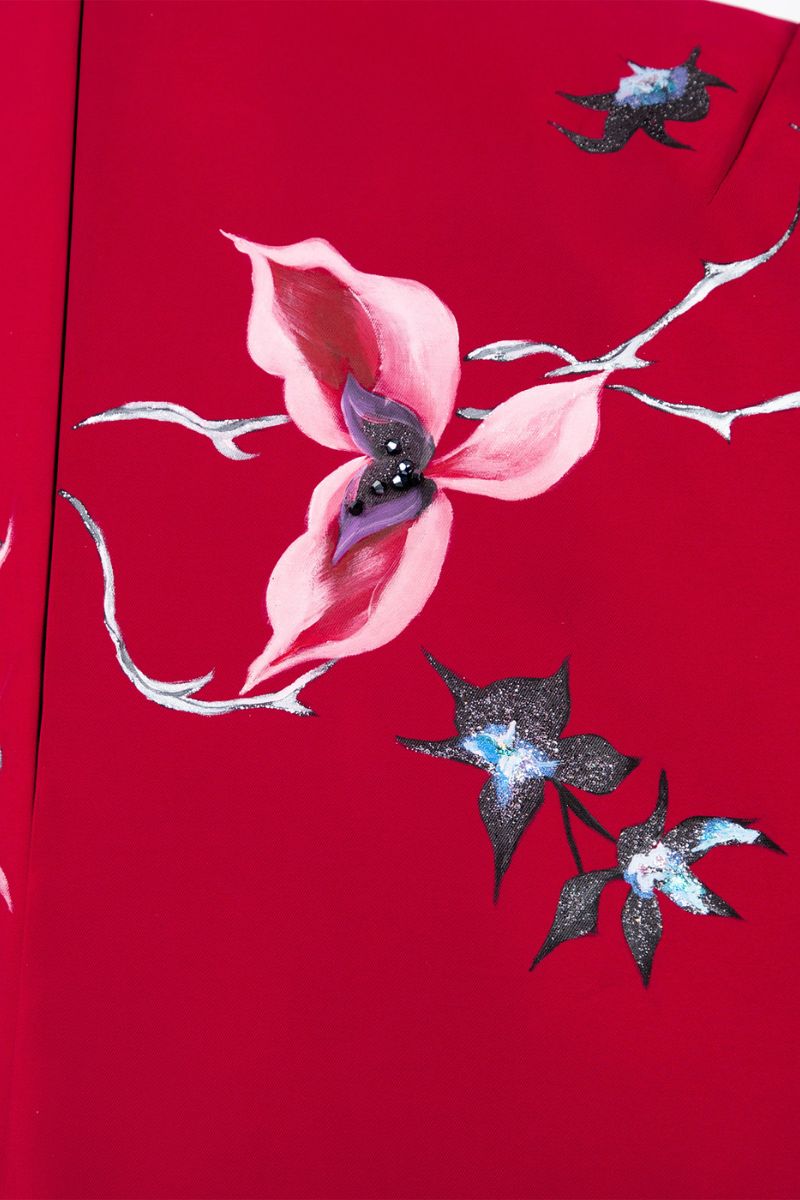 Dark red Crimson Cosmos gown by Tiny Ink featuring flowing fabric and intricate celestial-inspired design.
