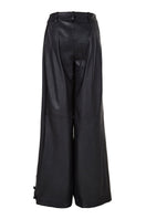 Black crossed leather pants by MAZ Manuela Álvarez, showcasing stylish design and tailored fit in a high-quality image.