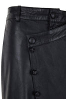 Black crossed leather pants by MAZ Manuela Álvarez, showcasing stylish design and fitted silhouette on a model.