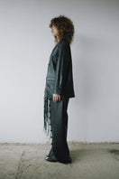 Black crossed leather pants by MAZ Manuela Álvarez featuring a stylish design and fitted silhouette.