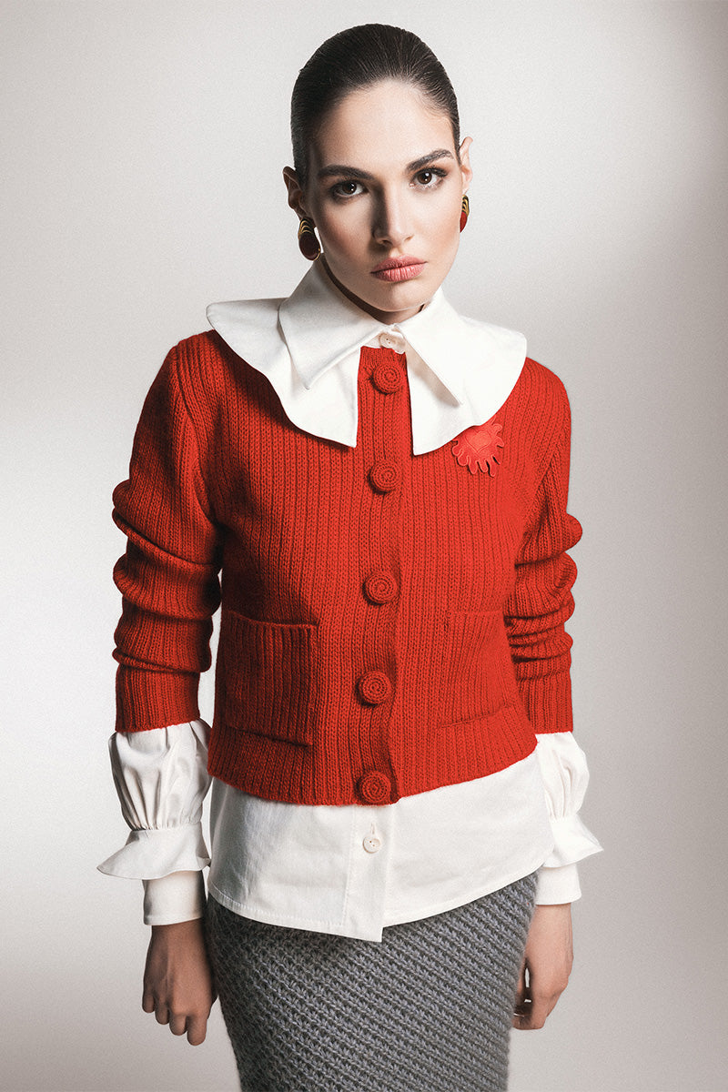 Red Liya cardigan with a soft knit texture, featuring a classic design and long sleeves, perfect for casual or layered outfits.