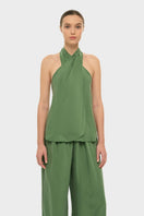 NiLuu AquaFlora cross halter top in moss green, featuring a stylish design with adjustable straps and floral details.