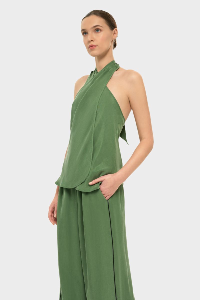 niLuu AQUAFLORA Cross Halter Top in moss green, stylish sleeveless top with a crisscross halter neckline, displayed on a neutral background.