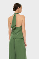 niLuu AQUAFLORA cross halter top in moss color, featuring a stylish design with adjustable straps, displayed on a white background.