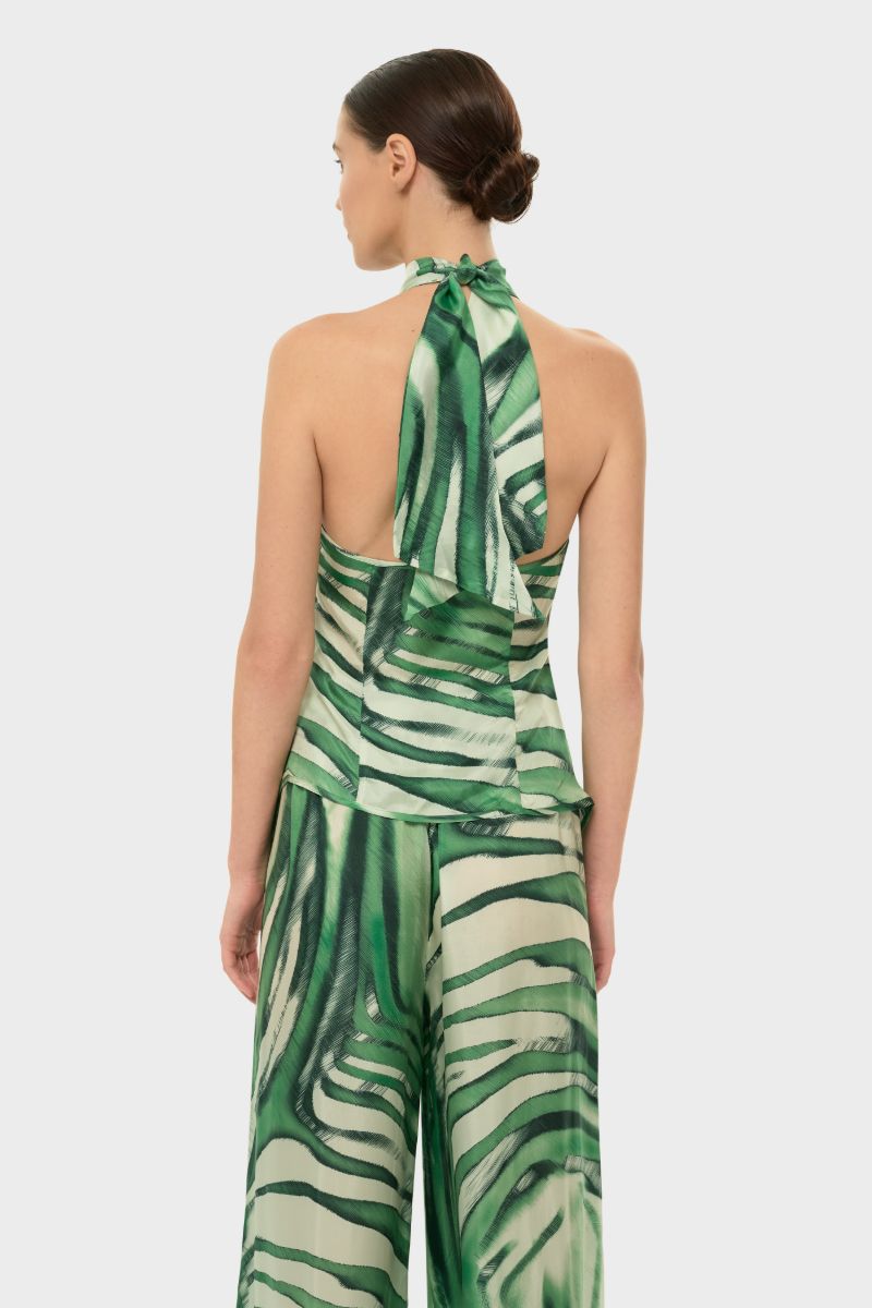 niLuu AQUAFLORA cross halter top in Rocco fabric, showcasing a stylish sleeveless design with a halter neckline and vibrant pattern.
