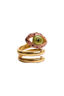 Sara & Flora terracotta spiral eye ring, showcasing a handcrafted copper ring with a spiral design and eye motif.
