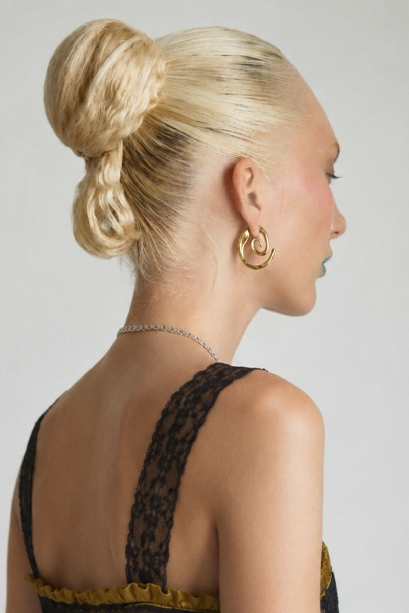 Sara & Flora spiral cat hoop earrings featuring sleek, modern silver hoops with a playful cat design.